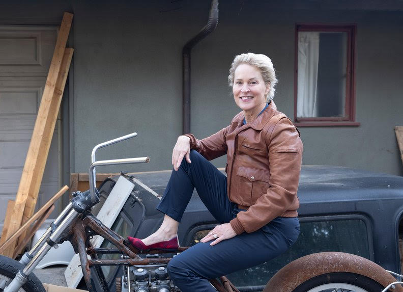 An image of Frances Arnold on a motorcycle