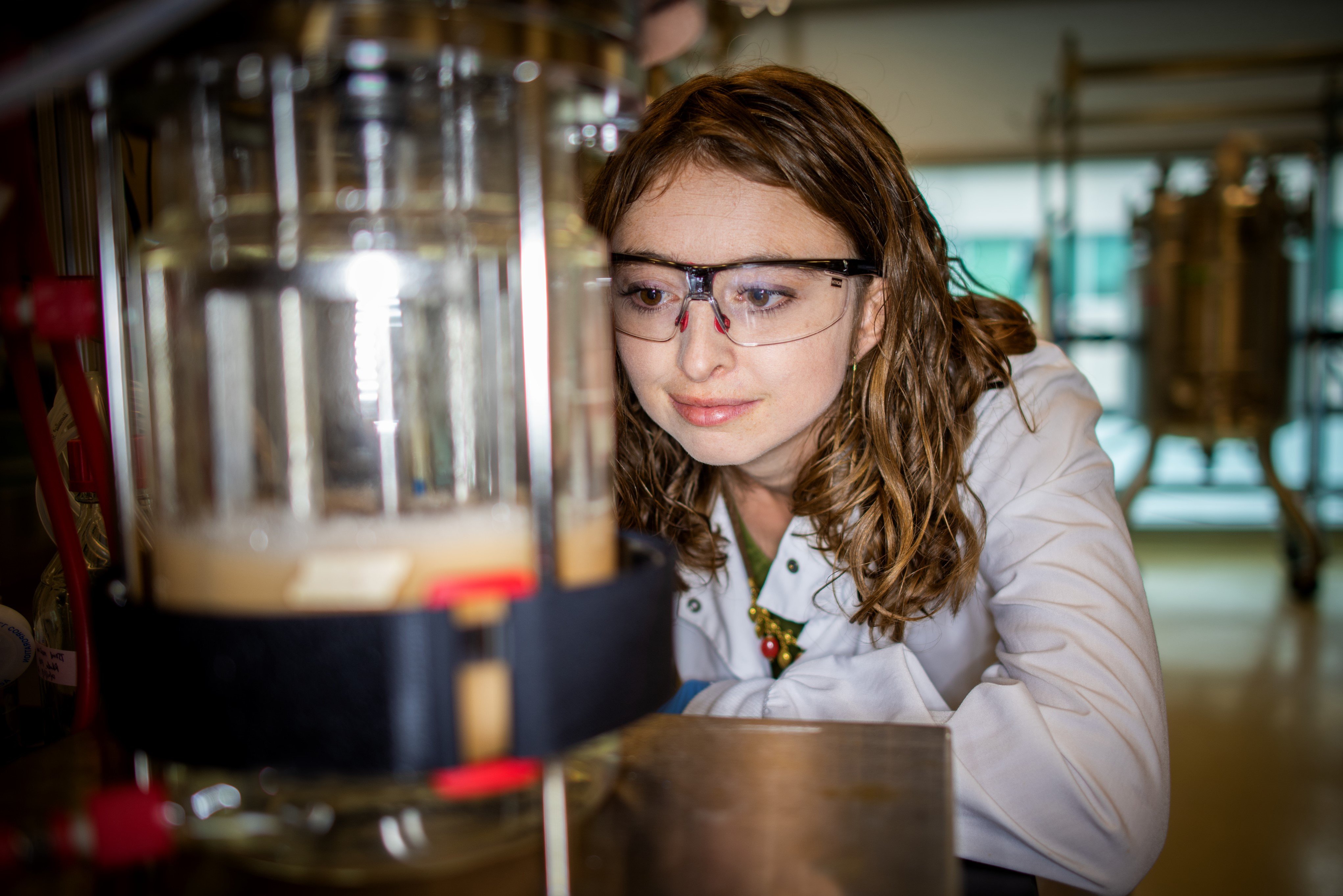 Photo of founder Tina Boville in a laboratory with fermentation bioreactor